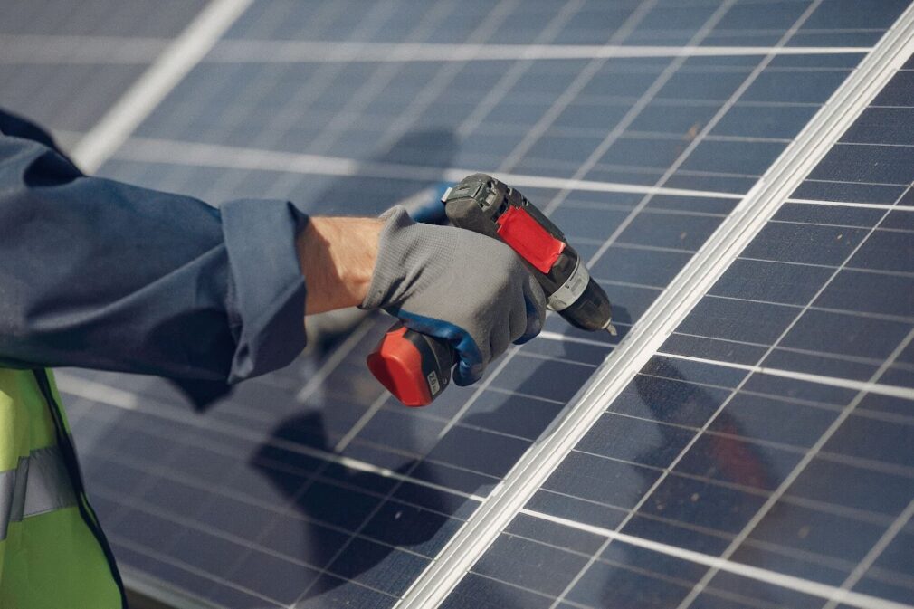 Man fixing a solar panel