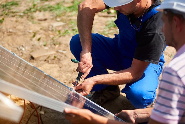 Workers Install Solar Panels