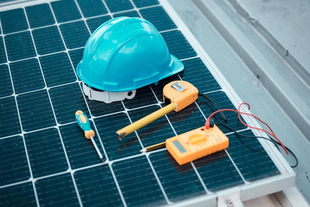 Blue hard hat and other tools for installing solar panels